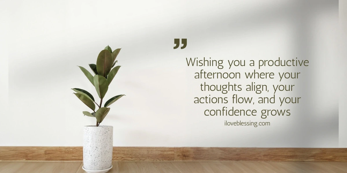 A potted plant sits on a wooden floor against a white wall. Next to it, a quote reads: “Wishing you a productive afternoon where your thoughts align, your actions flow, and your confidence grows.”.
